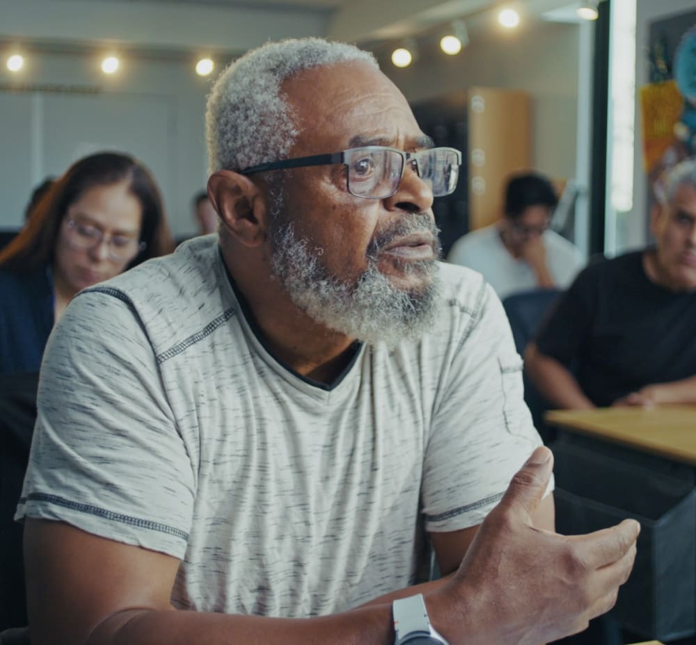man learning in a classroom