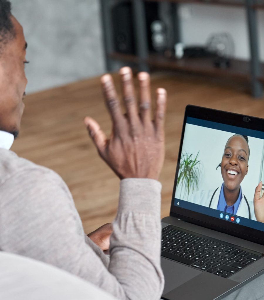 Male,Black,Patient,Talking,On,Conference,Video,Call,To,Female